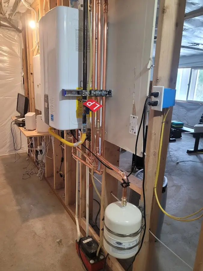 Licensed plumber repairing a kitchen sink in Denison